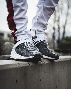 man standing on fence thumbnail