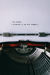 Closeup view of typing quotes on the old typewriter thumbnail