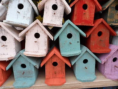 pile of bird house on top of beige table thumbnail