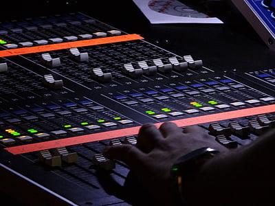 person standing near mixing console thumbnail