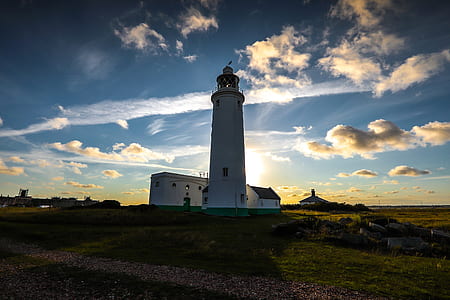 white lighthouse under blue thumbnail