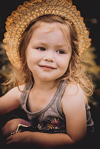girl wearing grey floral tank top in shallow focus photography with vignette effect thumbnail