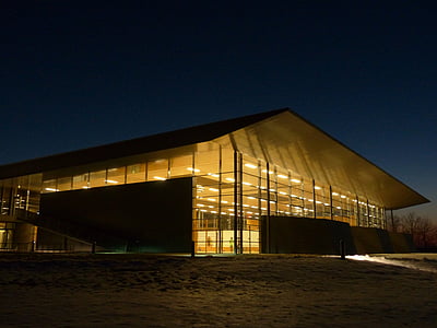 black and brown building at night time thumbnail