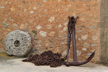 black metal anchor near black chain at daytime thumbnail