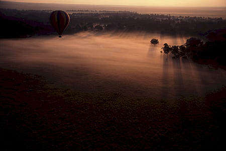 Hot Air Balloon Above Clouds during Sunset thumbnail