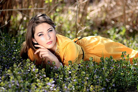 woman lying on green grass thumbnail