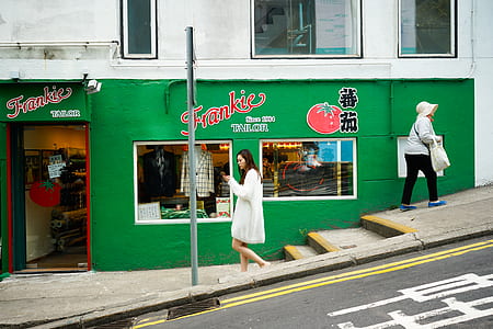 woman walking near stall thumbnail
