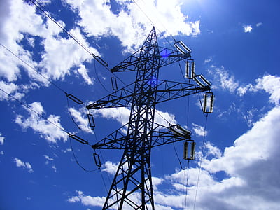 black metal tower under blue and white sky thumbnail