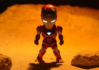 Iron-man collectible figure on sand thumbnail