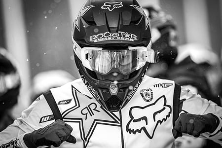 grayscale photography of man wearing helmet thumbnail