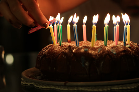 close-up photography of cake with lighted candles thumbnail
