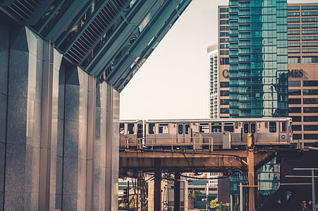 train surrounded by buildings thumbnail