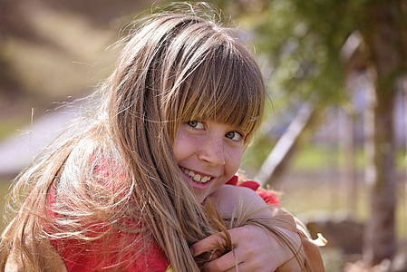 closeup photo of girl resting chin on her knee thumbnail