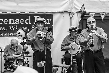 grayscale photo of people playing instrument thumbnail
