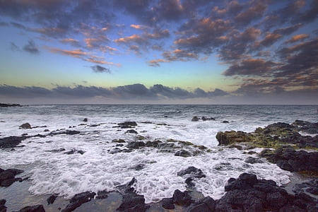 sea waves on rocks at daytime thumbnail