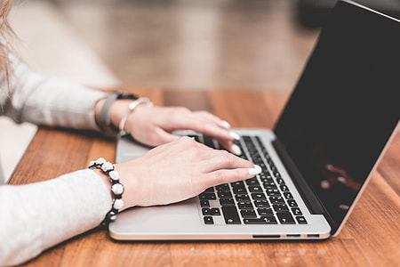 Young Woman Working/Typing on Her Laptop thumbnail
