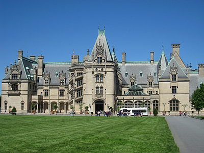 group of people in front of brown concrete structure thumbnail