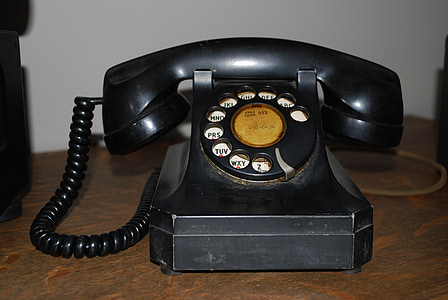 close photo of black rotary telephone thumbnail