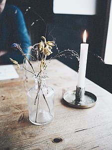 lighted white candle thumbnail