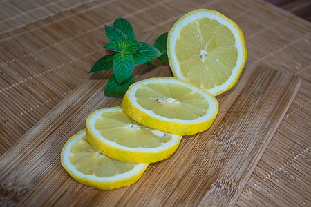 sliced lemon on chopping board thumbnail