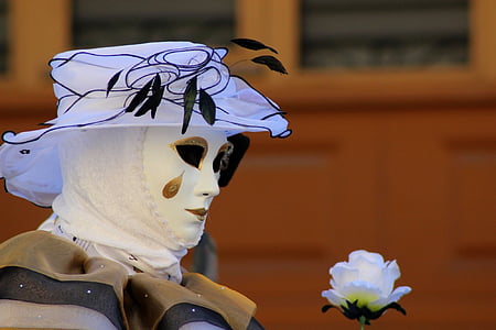 person in white mask holding white rose thumbnail