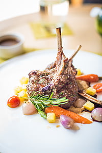 roasted meat with vegetables on plate thumbnail