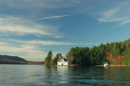 white house beside body of water thumbnail