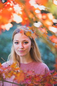 selective focus photography of woman in pink sweater thumbnail