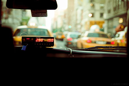 closeup photo of black taxi meter inside car photo thumbnail