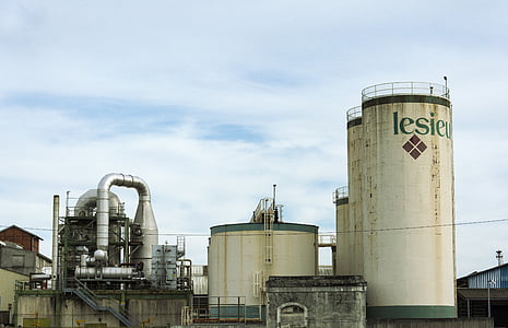 landscape photo of white factory under blue sky as background thumbnail