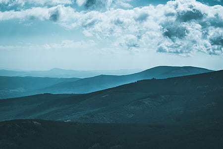 mountain under grey sky thumbnail