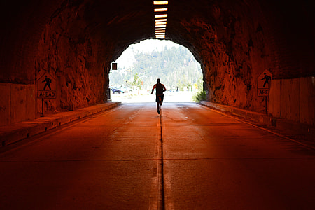 A man running/jogging in a tunnel thumbnail
