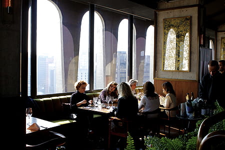 Group of People Sits Near Table thumbnail