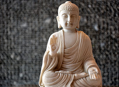 shallow focus photo of Gautama Buddha figurine thumbnail