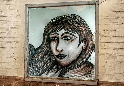 woman's portrait on wall thumbnail