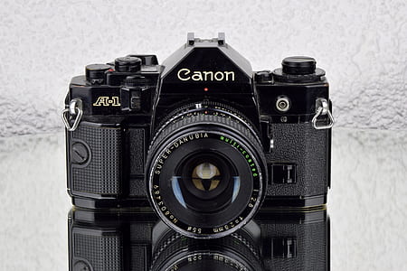 black Canon A-1 DSLR camera thumbnail