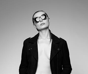 woman in black long-sleeved shirt wearing sunglasses thumbnail