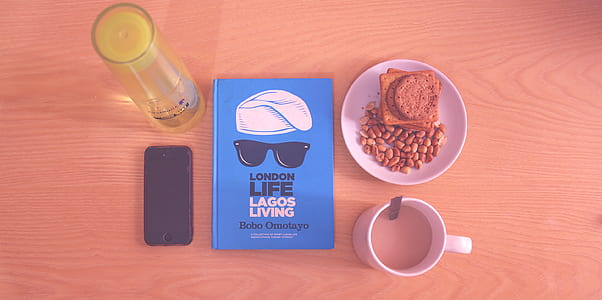 Peanuts and Biscuits in White Ceramic Plate Beside White Ceramic Mug Near Lagos Living Book thumbnail