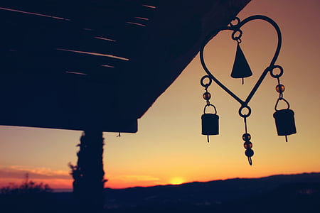 silhouette of wind chimes thumbnail