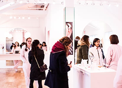 group of people standing in white painted wall room thumbnail