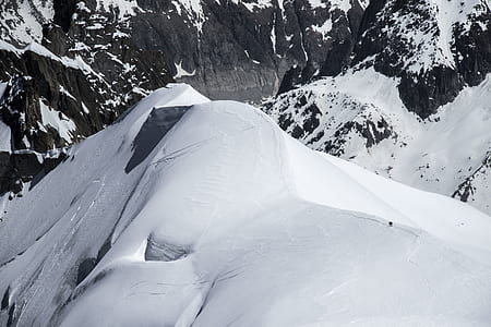 snow-covered mountains during daytime thumbnail