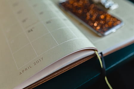 Home office desk with Macbook, iPhone, calendar, watch & organizer thumbnail
