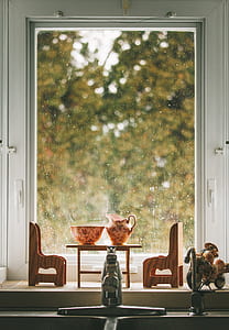ceramic teapot on mini table on windowsill thumbnail