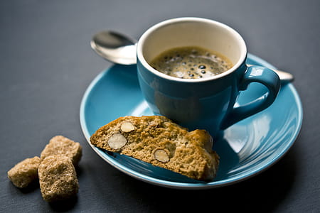 coffee in blue ceramic mug and cookie thumbnail