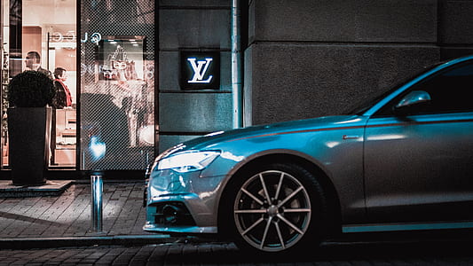 silver car next to sidewalk thumbnail