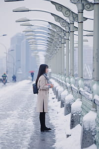 woman standing in front of post thumbnail