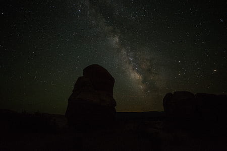 rock silhouette under night sky thumbnail