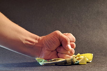 left person's fist on yellow paper thumbnail