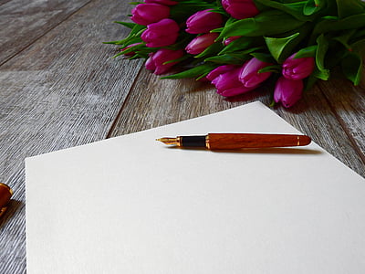 red fountain pen near bouquet of pink tulips thumbnail