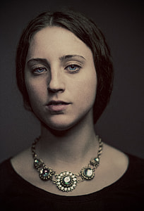 portrait of woman wearing necklace thumbnail